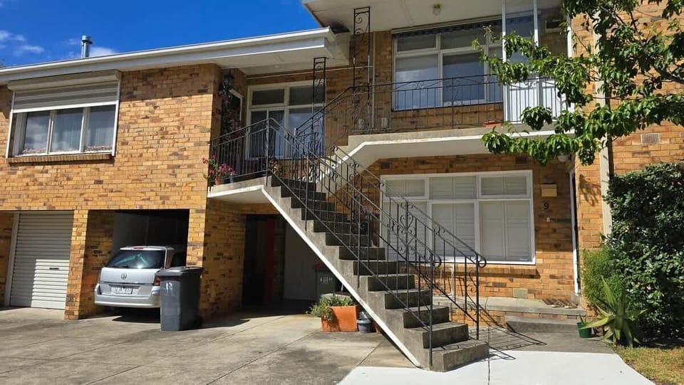 Access to the apartment is up 1.5 flights of stairs (front door is top left in photo)