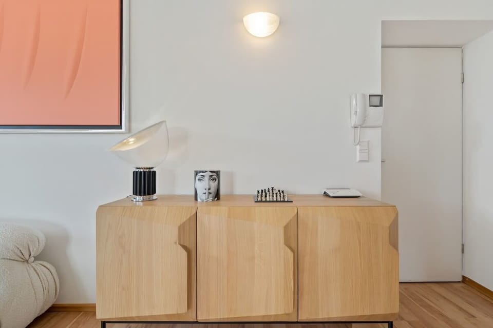 Our cozy nook, where modern design meets nature’s sunny blooms.