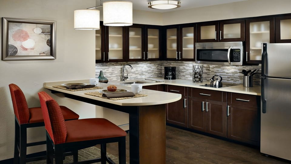Full-size fridge, microwave, stovetop, dishwasher