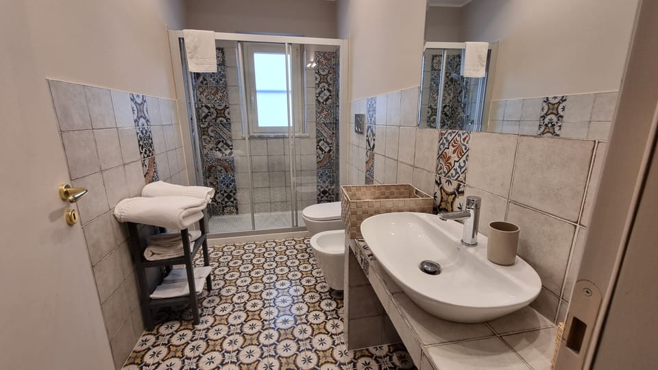 Comfort Room, Courtyard View | Bathroom | Free toiletries, hair dryer, slippers, bidet
