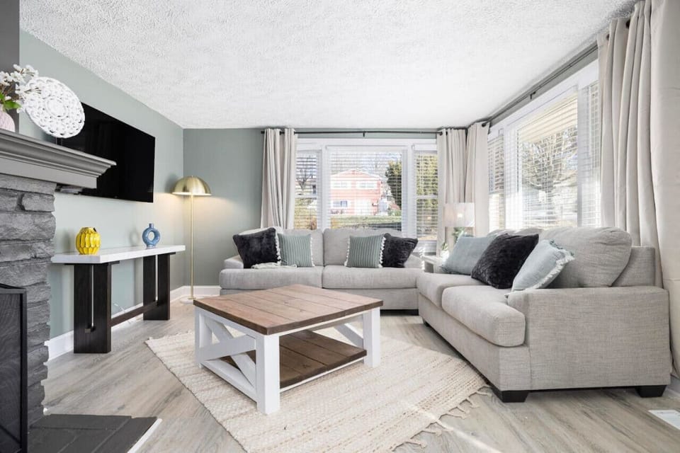 Relax and unwind in this cozy living room with all-new furnishings, perfect for quality time or catching up on your favorite shows.