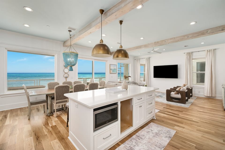 Unwind in this stunning oceanfront space where your morning coffee meets endless sea views through floor-to-ceiling windows.