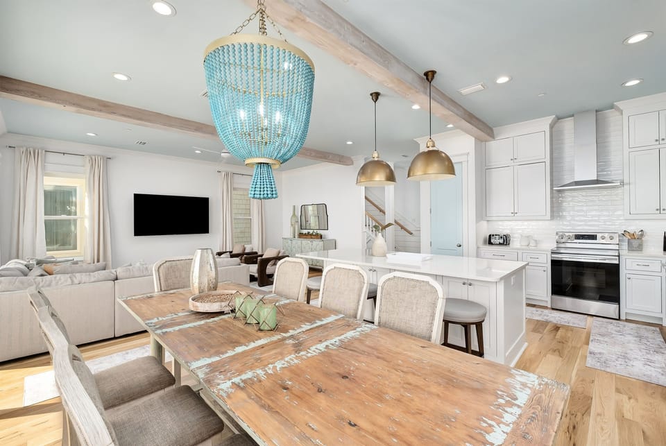 Gather around this stunning dining table where memorable meals await, while the open kitchen invites you to cook together.