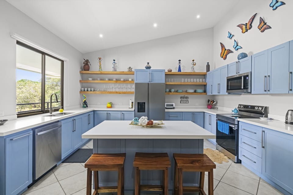 The large kitchen is equipped with small appliances (including an air fryer!) plus brand new stainless steel appliances and all of the kitchen amenities you need for vacation.  
