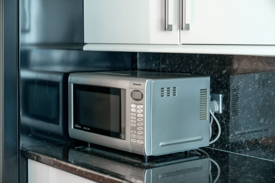 Comfort Apartment | Private kitchen | Full-size fridge, microwave, oven, stovetop