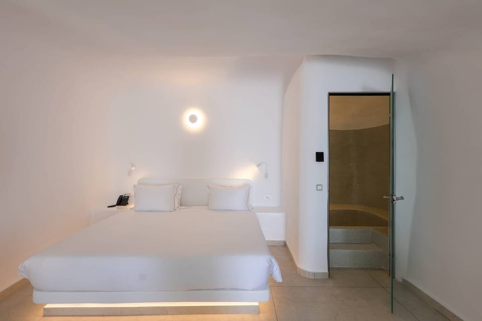 Junior Suite with hammam (Caldera View and Indoor Hot tub) | Premium bedding, down comforters, individually furnished, bed sheets