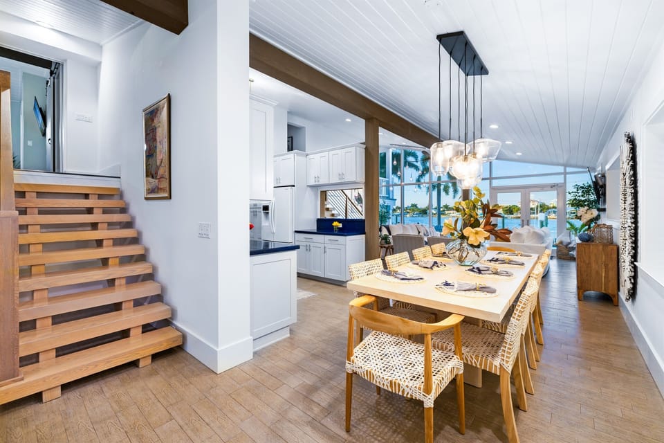 As you walk into the home, you’ll find the inviting dining area and immediate views of the water.