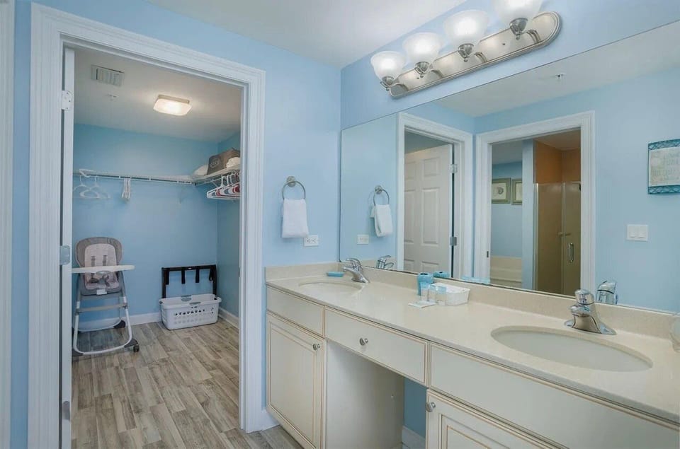 Master bathroom with dual vanity sinks and walk in shower + soaking tub