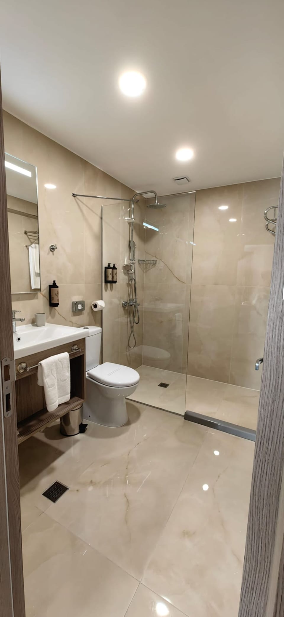 Shower, rainfall showerhead, designer toiletries, hair dryer