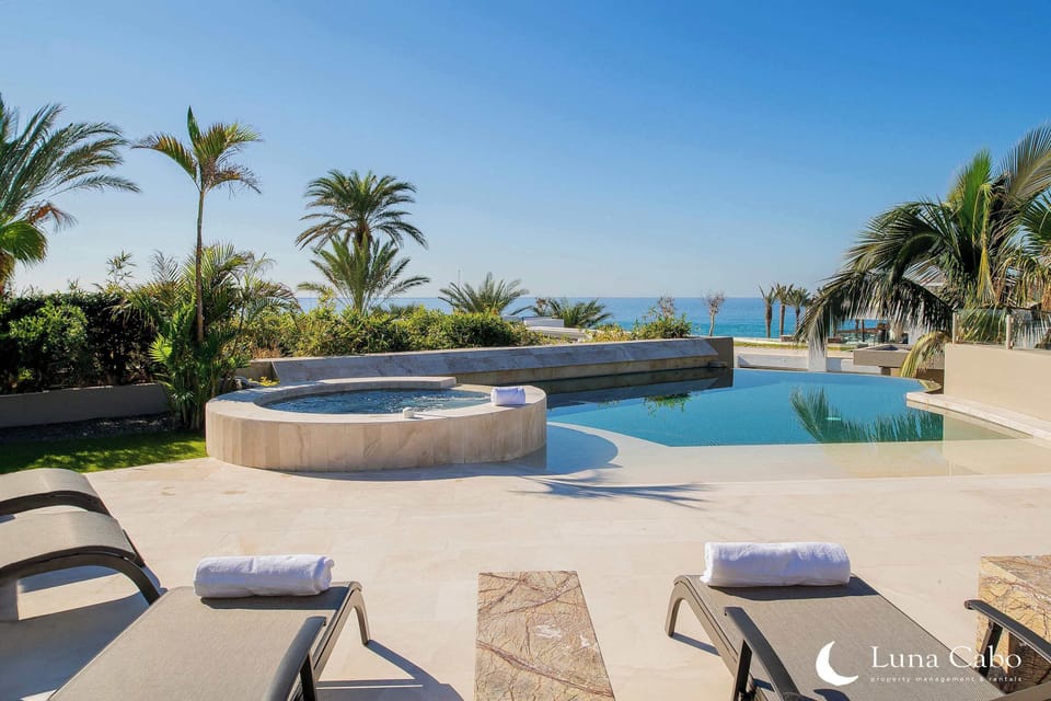 Private hot tub with a view of the ocean, perfect for relaxing evenings.