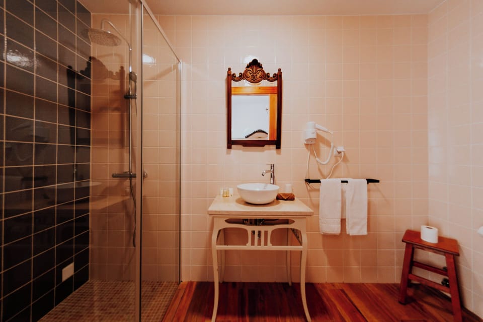 Deluxe Double Room, 4 Bedrooms, Private Bathroom, Garden Area | Bathroom | Shower, rainfall showerhead, free toiletries, hair dryer