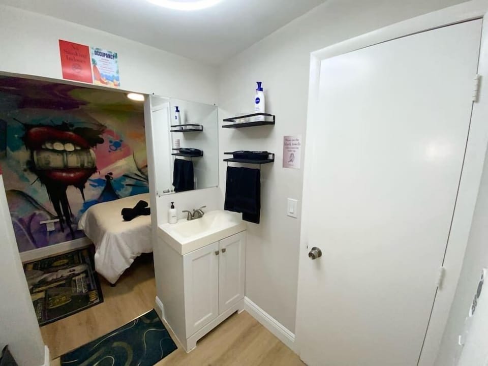 Unit 2's cozy bathroom—a compact haven with all essentials. Q-tips, lotion, shampoo, conditioner, and body wash await your indulgence. A small space with big comforts, ensuring a delightful stay. 