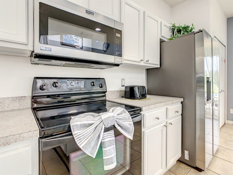 Modern kitchen appliances and thoughtful touches for a cozy cooking experience.