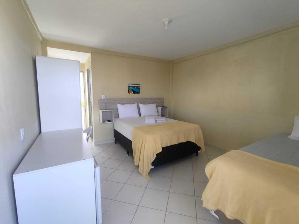 Deluxe Triple Room, Multiple Beds, Lanai, Sea View | Desk, laptop workspace, free WiFi, bed sheets