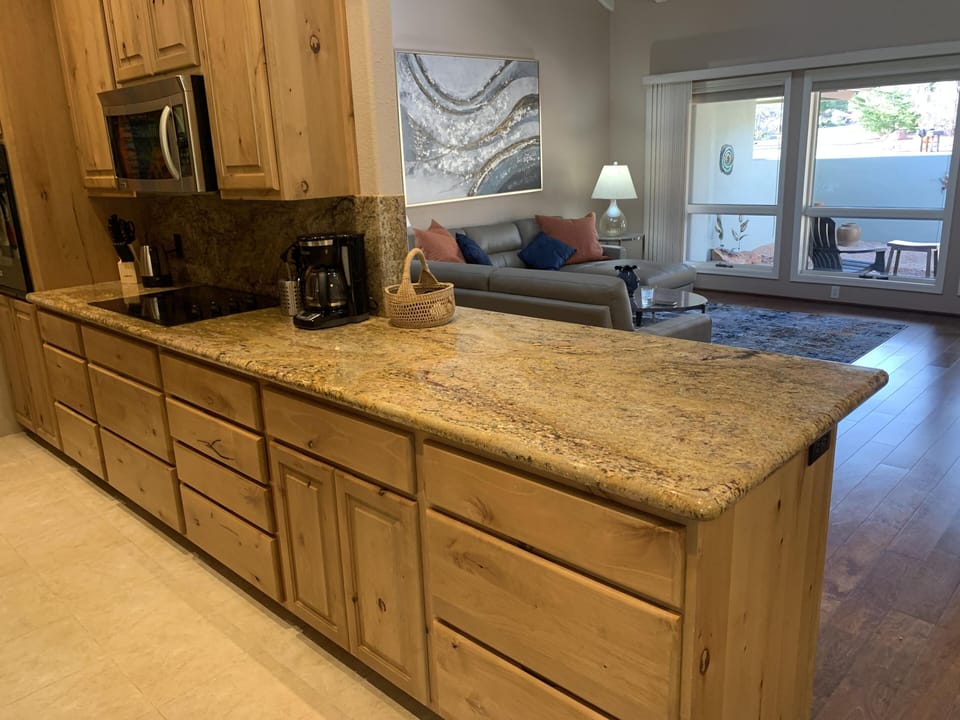 Kitchen opens to living room and dining area.