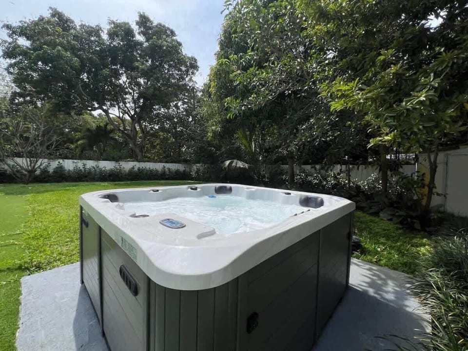 Soak in serenity — our private outdoor hot tub offers the ultimate relaxation experience, just steps from the pool and lush backyard oasis.