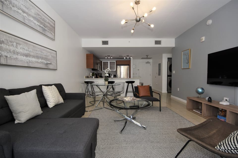 Comfort Apartment | Living area | 55-inch TV with digital channels