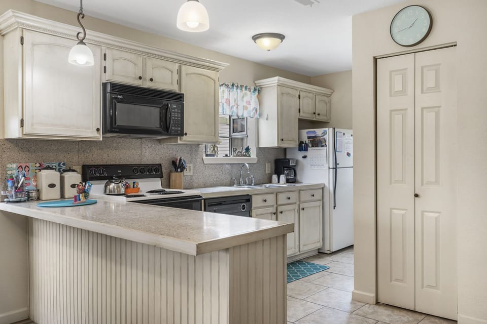 Whip up a delicious meal in the fully equipped kitchen - the heart of your cozy condo that's sure to inspire your inner chef!