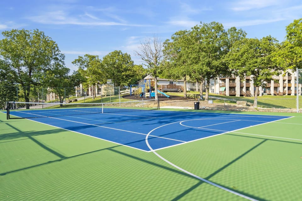 Serve, volley, play! Our versatile court is ready for tennis and pickleball enthusiasts, with the playground just beyond for the little ones. Everyone in the family finds their perfect play space at our resort!