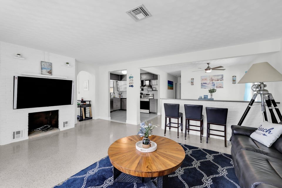 Spacious living room with reclining seats and plenty of seating.