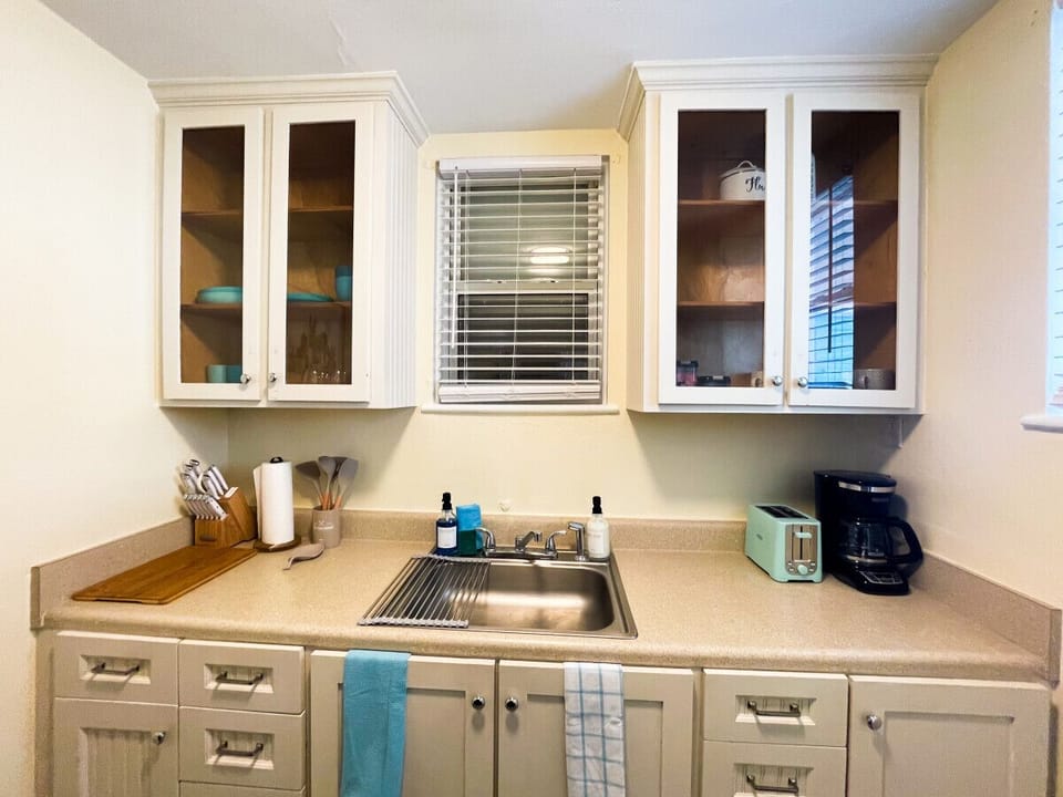 Kitchen has most of your cooking needs. Including coffee maker, toaster, microwave, oven, and refrigerator,