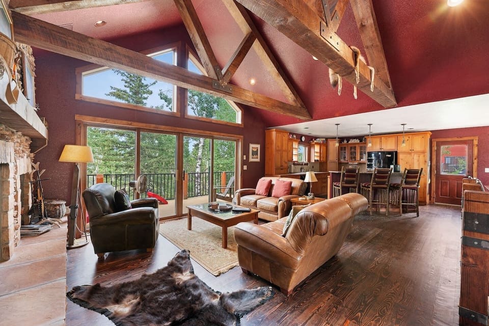 The wall of glass brings the beauty of the Black Hills into the cabin.