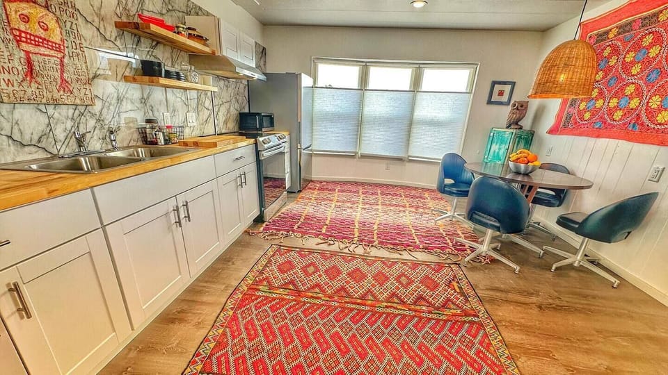 Everything in the kitchen is new, shaker cabinets, new counters, new marble tiles on the entire wall backing the kitchen, new stainless appliances and fun decor.