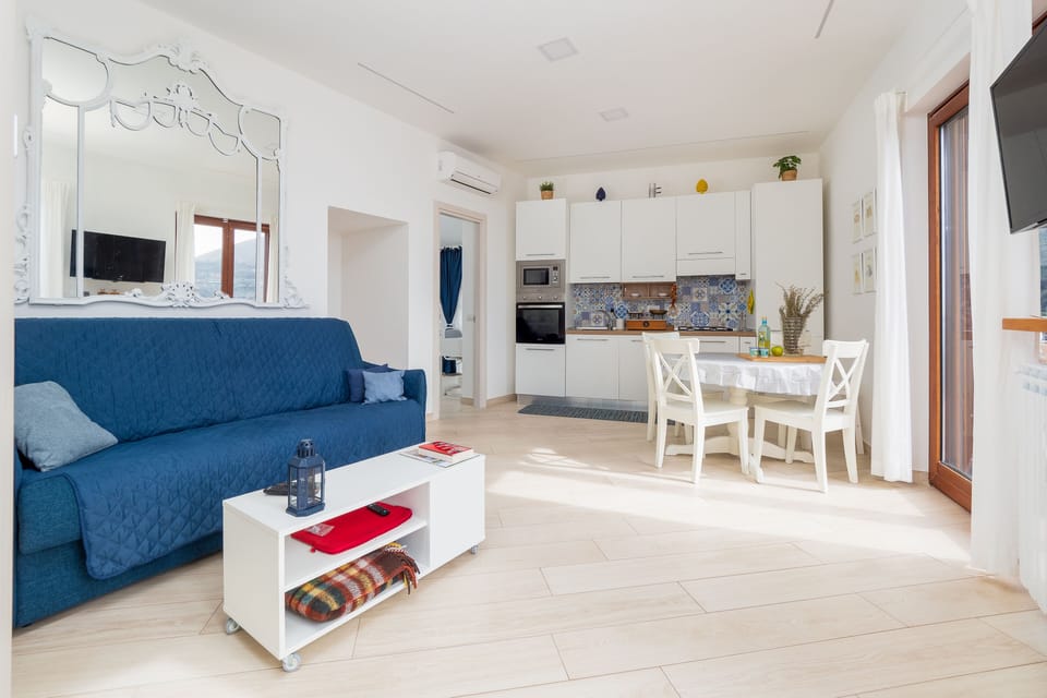 Panoramic Villa | Living area | 50-inch flat-screen TV with digital channels