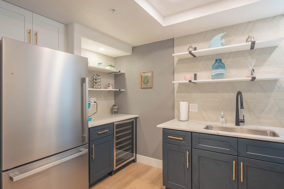 A bright, modern space where culinary creativity thrives, complete with sleek surfaces and welcoming warmth.