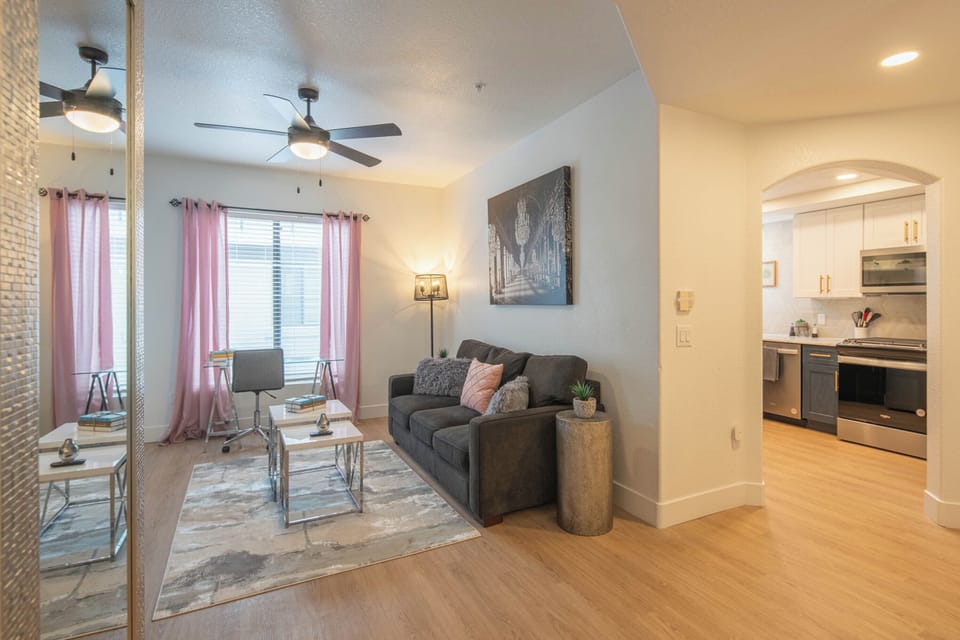 A warm, sunlit haven perfect for relaxing or entertaining, with plush seating, Smart TV, and thoughtfully curated decor.