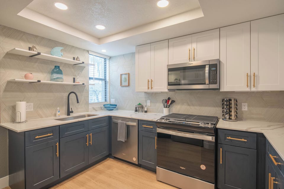 A bright, modern space where culinary creativity thrives, complete with sleek surfaces and welcoming warmth.