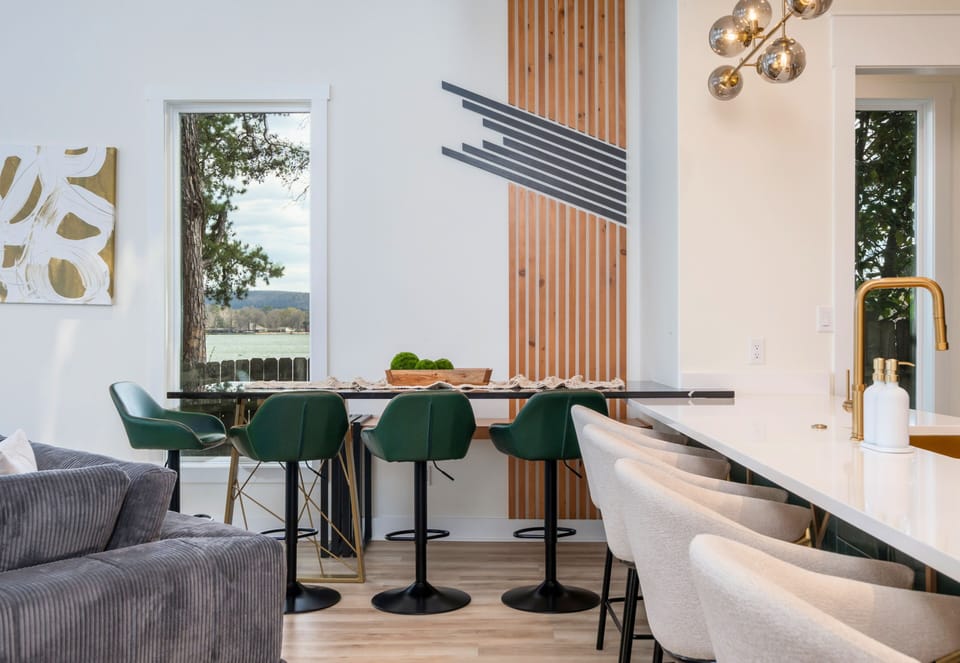 Shared meals become even more memorable in this inviting dining area surrounded by lakehouse charm.