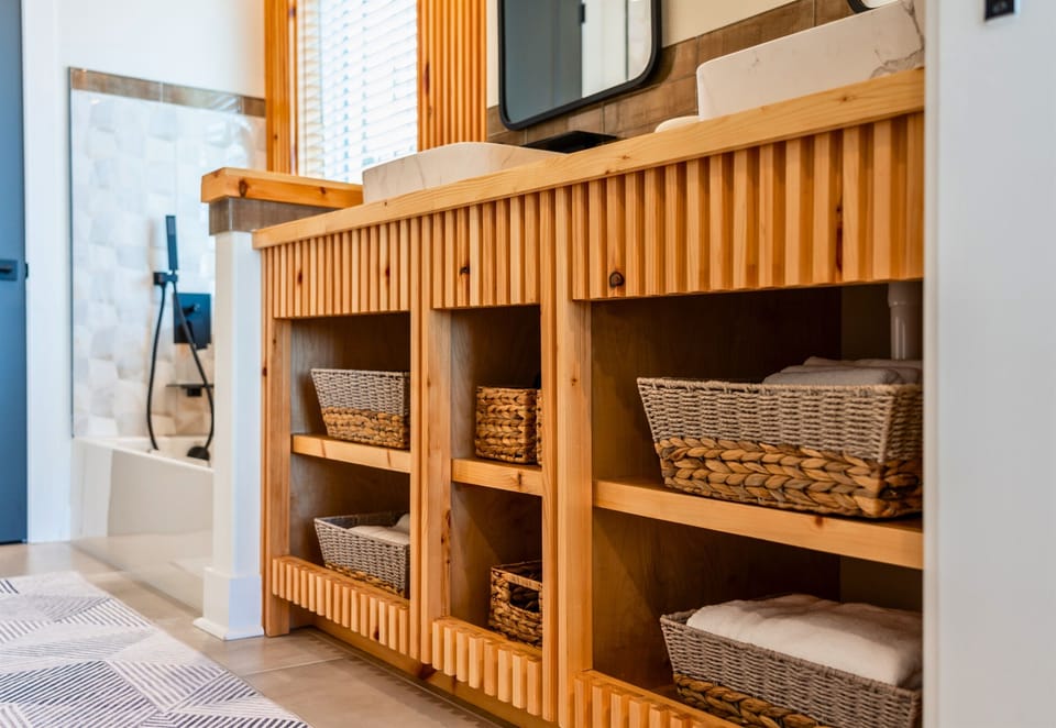 Wooden Vanity with Wicker Baskets Below for Storage