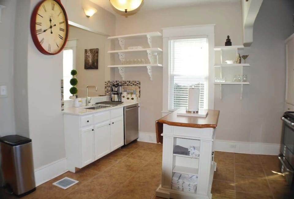 The warm lighting and clean countertops create a relaxing vibe. After a long day, it's nice to have a tidy space to enjoy a homecooked meal.