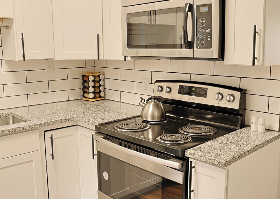 Kitchen-fully equipped and newly updated with granite countertops and stainless steel appliances