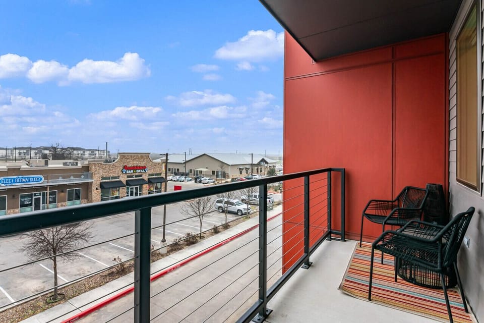 Spacious outdoor balcony with shopping views