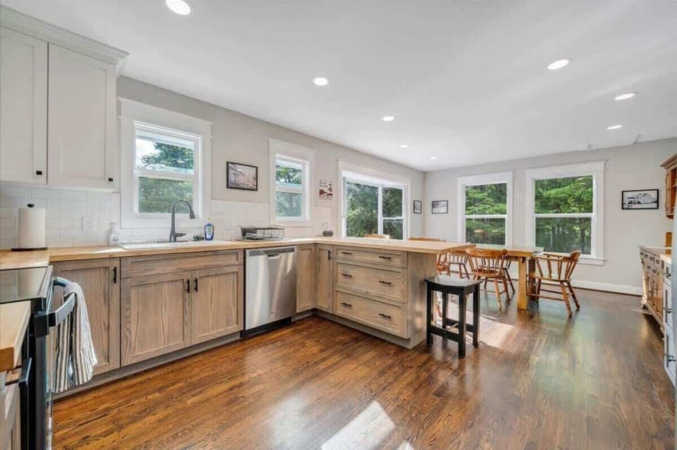 Bright kitchen with wide countertops and wood flooring