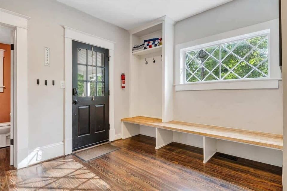 Mudroom area with benches and storage