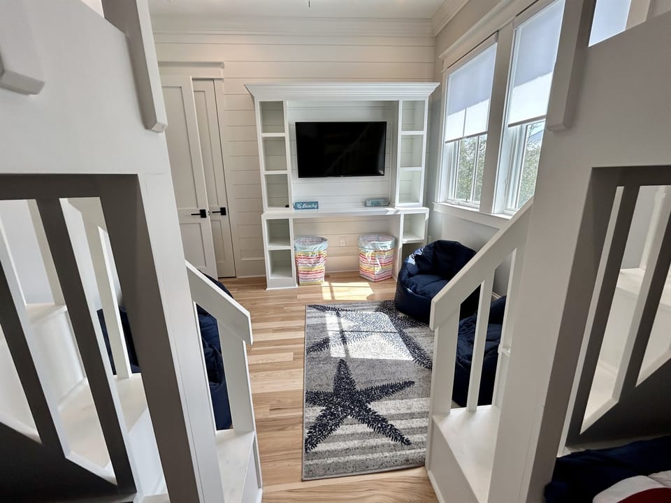 Your kids will love this cozy loft space with built-in entertainment center and comfortable seating for family movie nights.