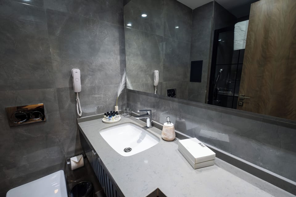 Shower, free toiletries, hair dryer, slippers