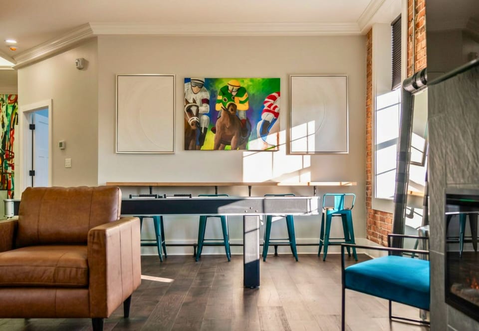 [Shuffleboard] Lots of Natural Light and the Crown Molding Lighting Makes This Space Inviting