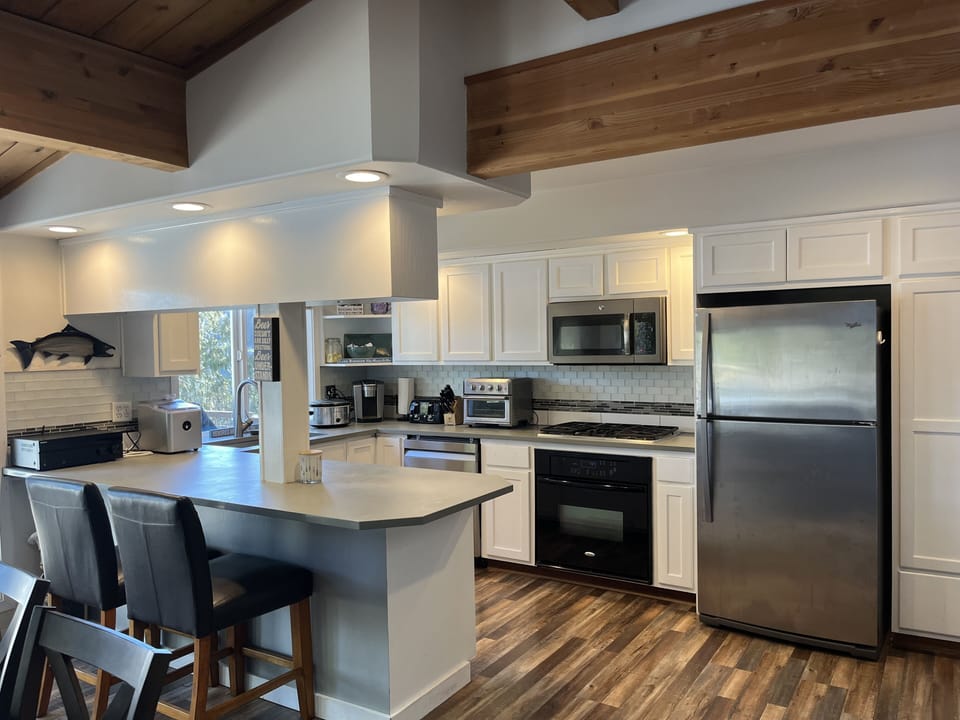 Kitchen, microwave, stove, oven and coffee. 