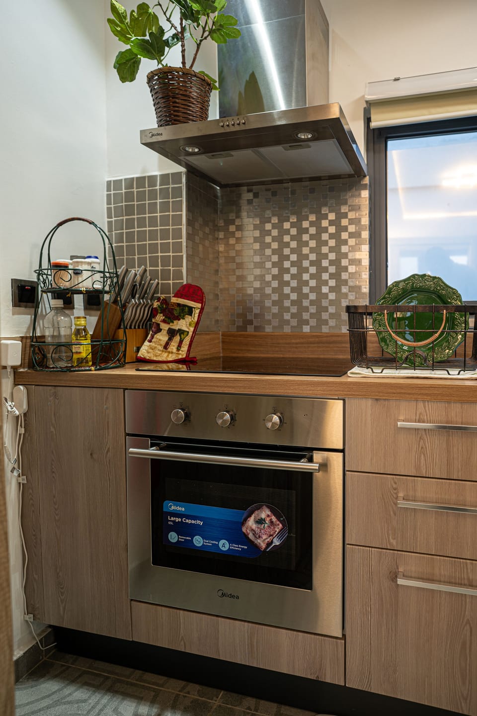 Fully equipped kitchen with cookware and essentials for short/long stays.