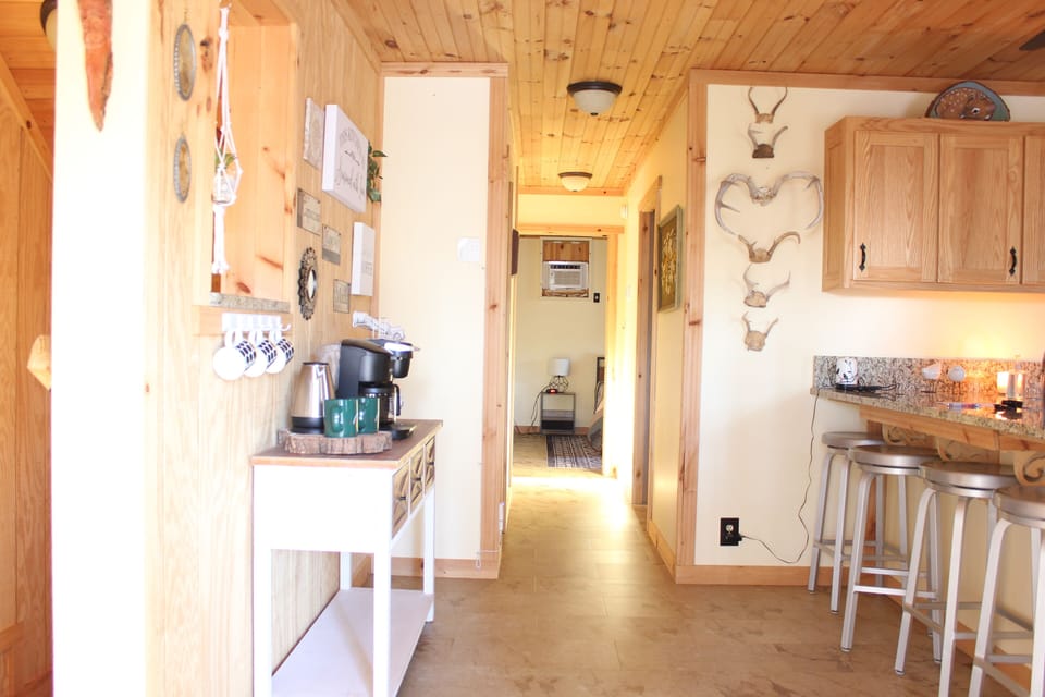 View of hallway from front entry way to bedrooms. 