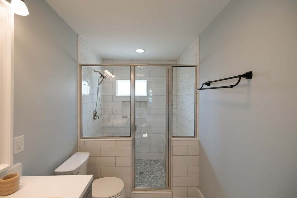 Modern bathrooms stocked with essential toiletries and luxury Missio Hair products sourced locally in Wilmington.