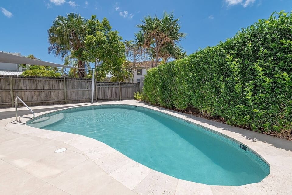Enjoy the secluded communal pool just steps away, perfect for a refreshing dip