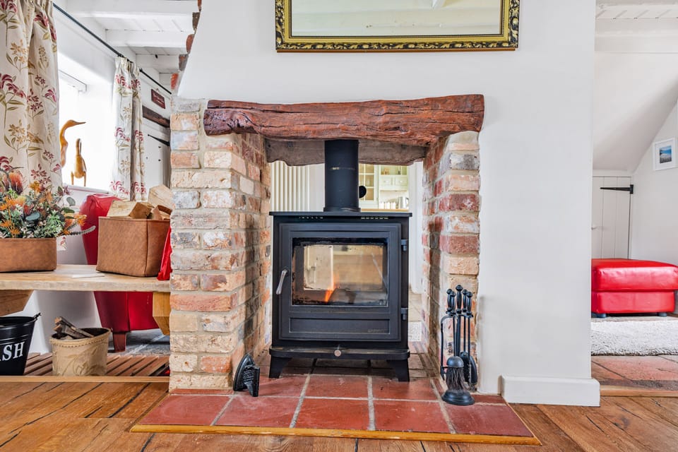 Fiddlers Green, Hamworthy, Poole: The double-sided wood burning stove provides a great focal point