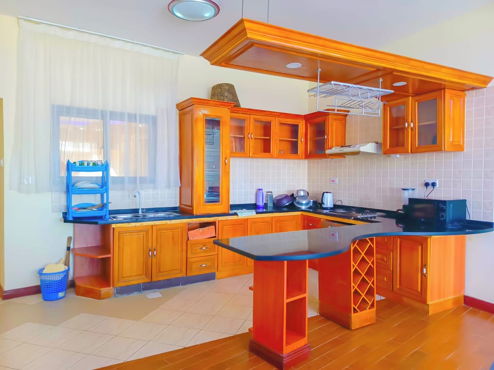 Fridge, microwave, oven, cookware/dishes/utensils