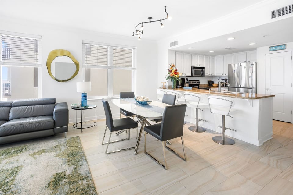 Your modern open-concept space flows beautifully, with sleek kitchen, dining area, and comfortable living room perfect for relaxing after exploring the city.