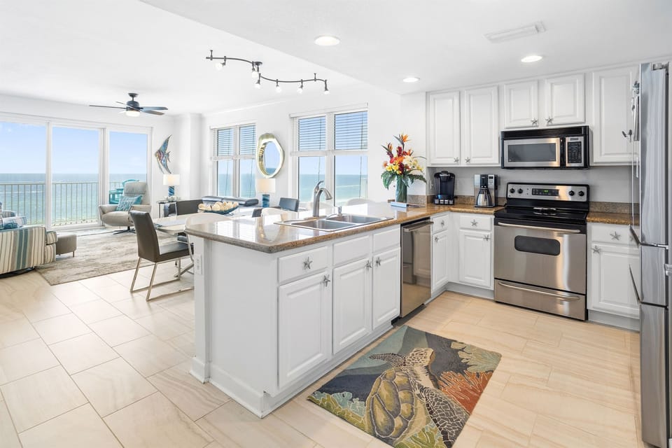 Cook with stunning sea views in your fully equipped kitchen featuring stainless steel appliances and granite countertops.